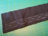 Chalk curves on linen The same strip of linen with a curved pattern (again in chalk) added between the straight lines.